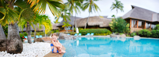 Fototapeta premium Little girl at swimming pool