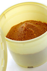 homemade miso in a barrel