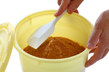 homemade miso in a barrel