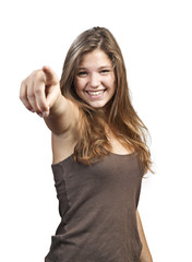 Happy woman with hand pointing at you - isolated over a white ba