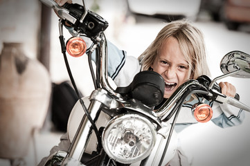 Rogue Child riding a motorcycle © Riccardo Piccinini