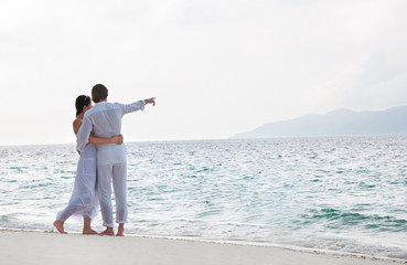 Picture of romantic young couple on the sea shore