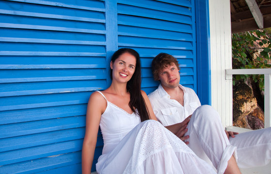 Romantic young couple in tropical beach house