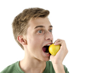Young man eating apple