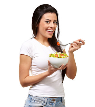 Young Girl Eating Salad From Bowl
