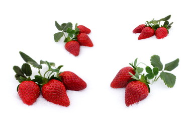Obraz na płótnie Canvas Fresh strawberries grow up in the snow, valentine's day