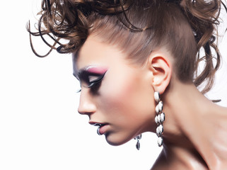 Fashion woman - bright hairstyle, earrings, stylish make-up