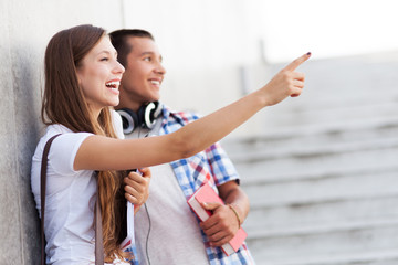 Young couple pointing
