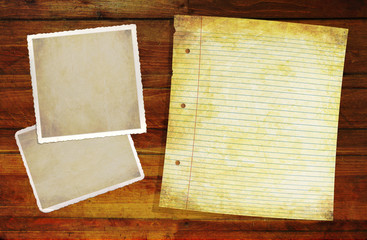 Wooden Background with blank old notepaper and photo blanks.
