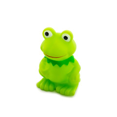 The toy Cheerful green frog smiles.