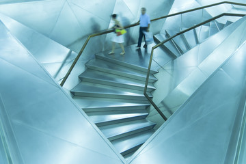 blue stairs, with people moving
