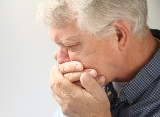 older man getting ready to vomit