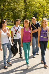 Students walking to school teens happy campus