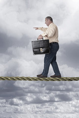 Businessman at tightrope