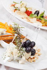 Cheese plate with grapes and honey
