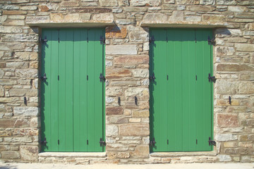 double green doors, stone wall