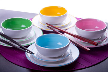 Multicolored Chinese bowls with chopsticks