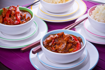 Chinese bowls with rice and sweet and sour chicken