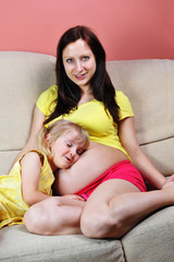 girl and her pregnant mother