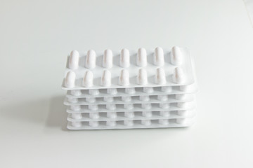 Fototapeta na wymiar Blister stack packs of white pills