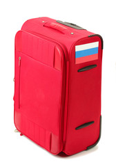 red suitcase with sticker with flag of Russian Federation