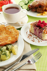 Roast chicken cutlet with boiled potatoes and  vegetables, cup