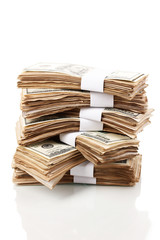 Stack of one hundred dollars banknotes close-up isolated