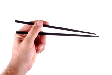 man hand holding black japanese chopsticks
