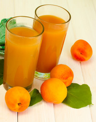 glasses of apricot juice  and fresh apricots