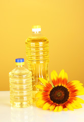 sunflower oil in a plastic bottlea on yellow background