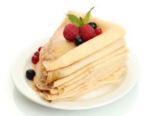 Delicious pancakes with berries and honey
