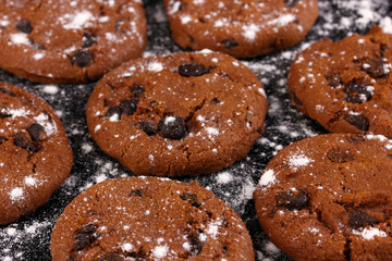 Chocolate chips cookies isolated on black