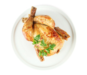 Roasted whole chicken on a white plate isolated on white