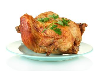 whole roasted chicken with parsley isolated on white
