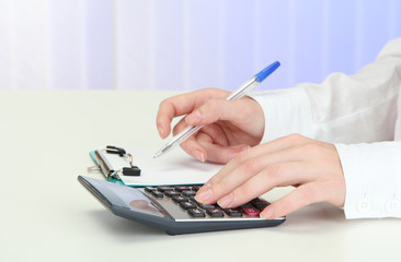 Fototapeta premium Closeup of businesswoman hands, writing on paper