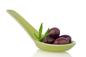 Olives on ceramic spoon