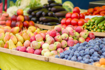 Pears, apples, plums, cucumbers, tomatoes, eggplants in city mar