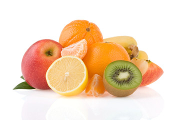 fresh tropical fruits and slices isolated on white