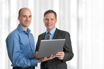 Two business men with laptop