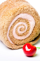 Fototapeta premium Spa concept, towel roll and sweet cherry berry