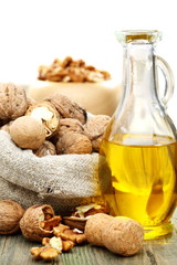 Walnut oil  and nuts in a bag.