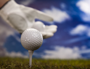 Hand and golf ball