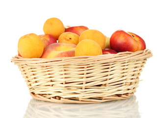 Ripe fruit in basket isolated on white