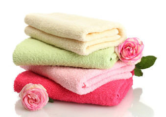 Obraz na płótnie Canvas bright towels and roses isolated on white