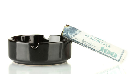 Cigar of the 100 dollar bill and an ashtray isolated on white