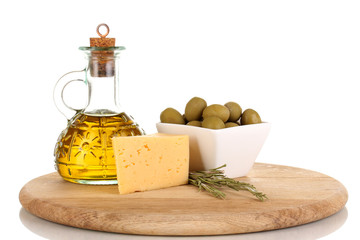 Green olives in white bowl with rosemary,olive oil and cheese