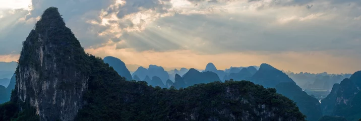 Foto auf Leinwand Aerial view mountain range at sunset ray from Moon Hill, China © petunyia