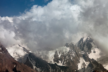 mountain peaks in the clouds, Switzerland.