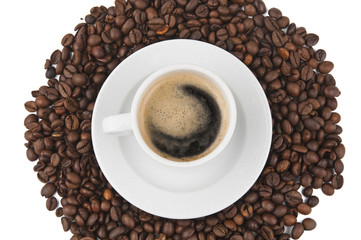 Coffee beans and cup of coffee background isolated