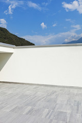 large terrace of a modern white house, wall
